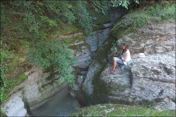 Women sitting near a mountain river during a Silent Retreat